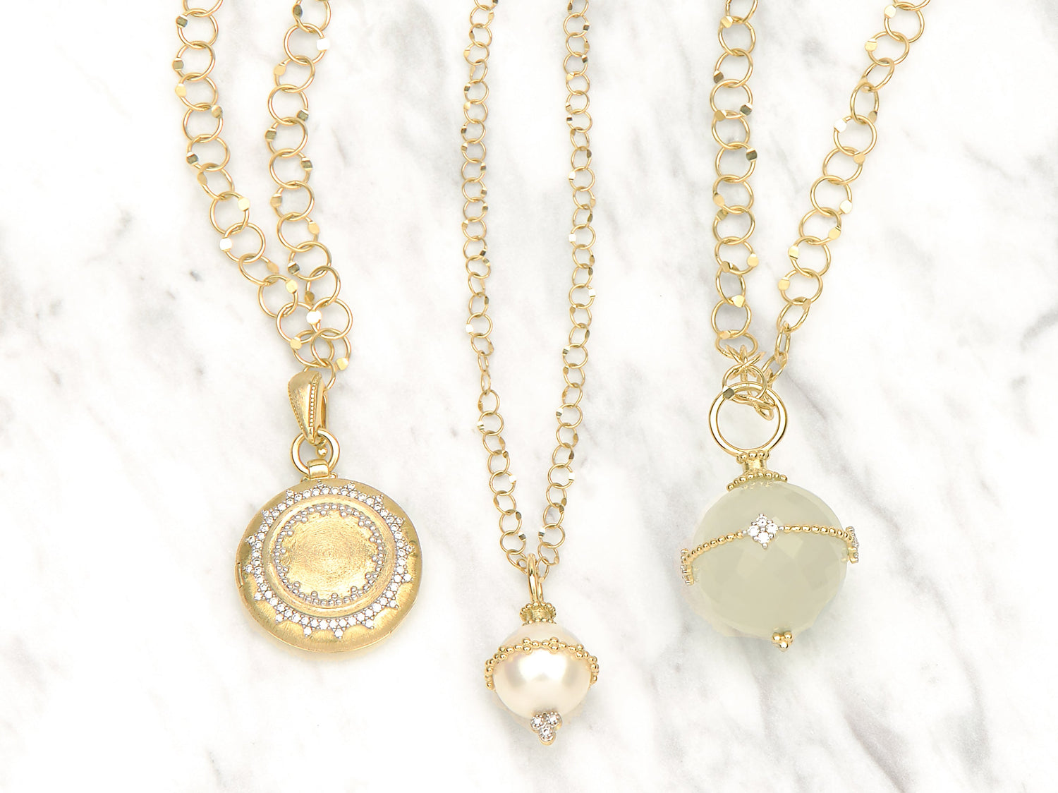 three pendant gold necklaces