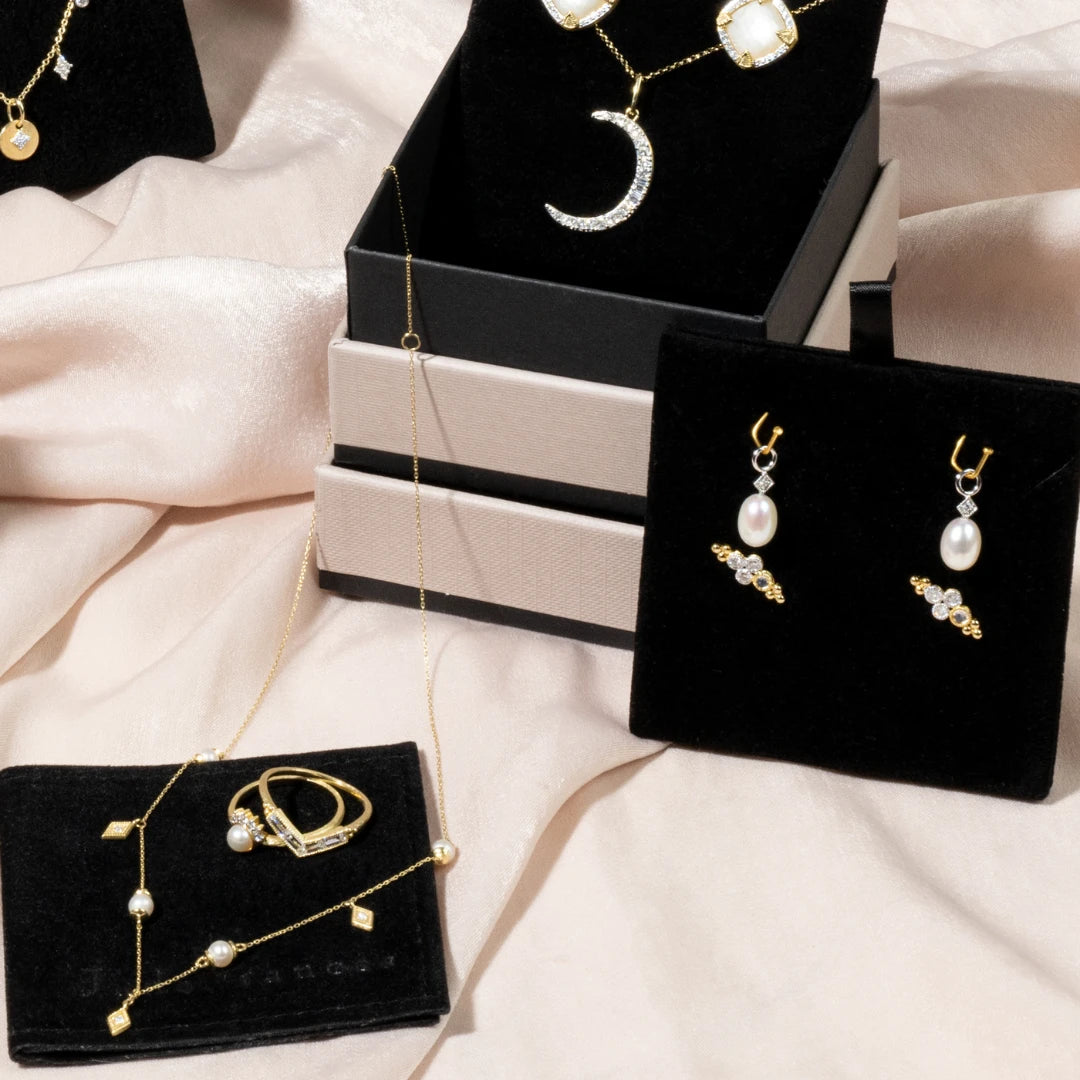 different jewelry pieces in gift boxes