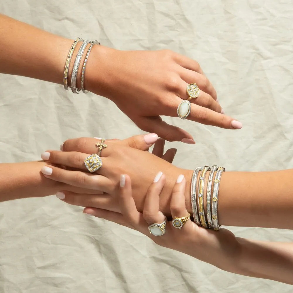 hands with bracelets and rings