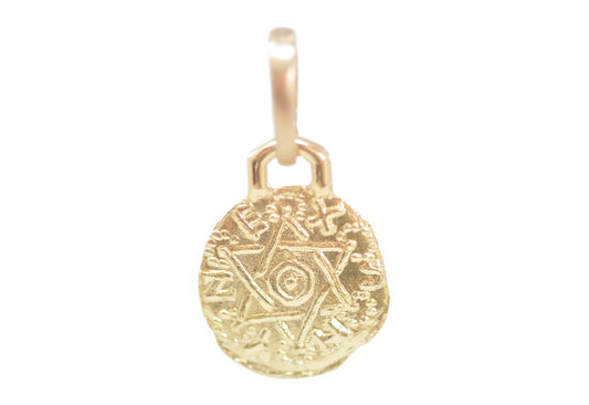 front of the gold pendant