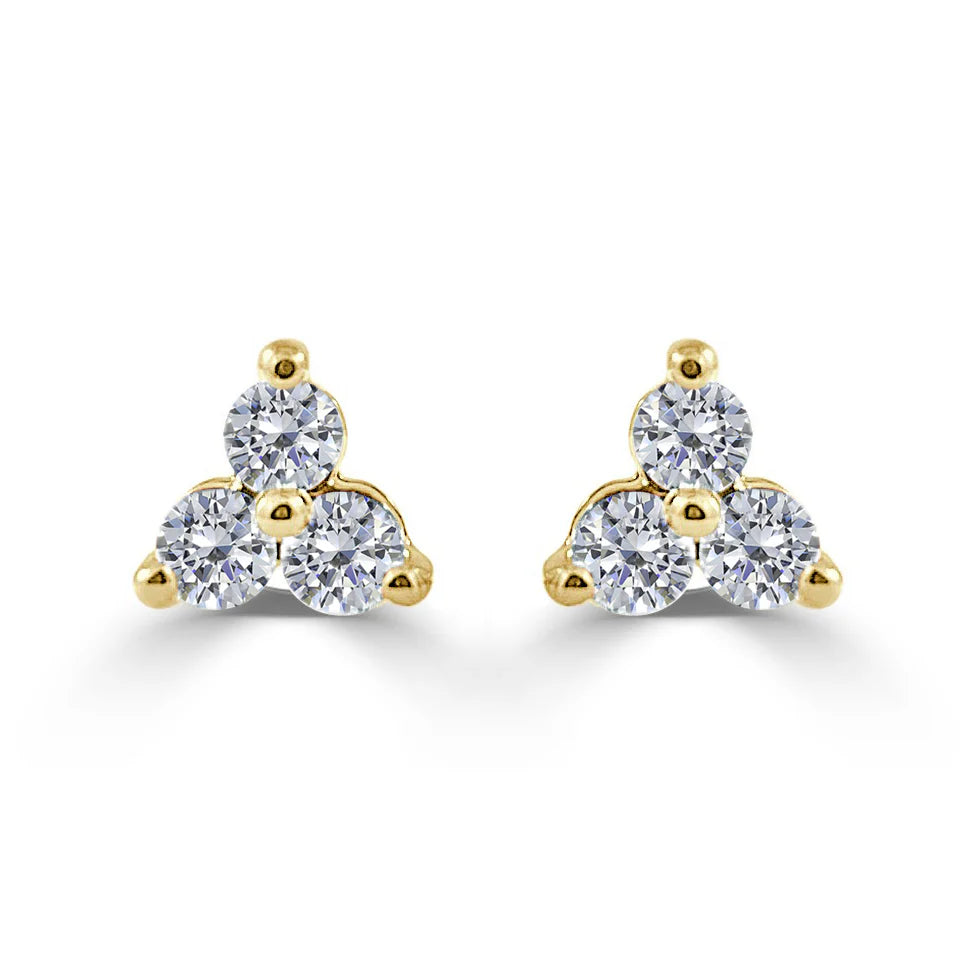 three diamond stud earrings with gold 