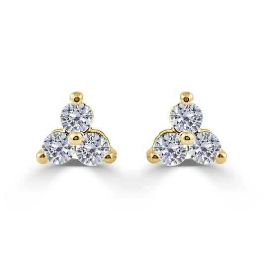 three diamond stud earrings with gold 