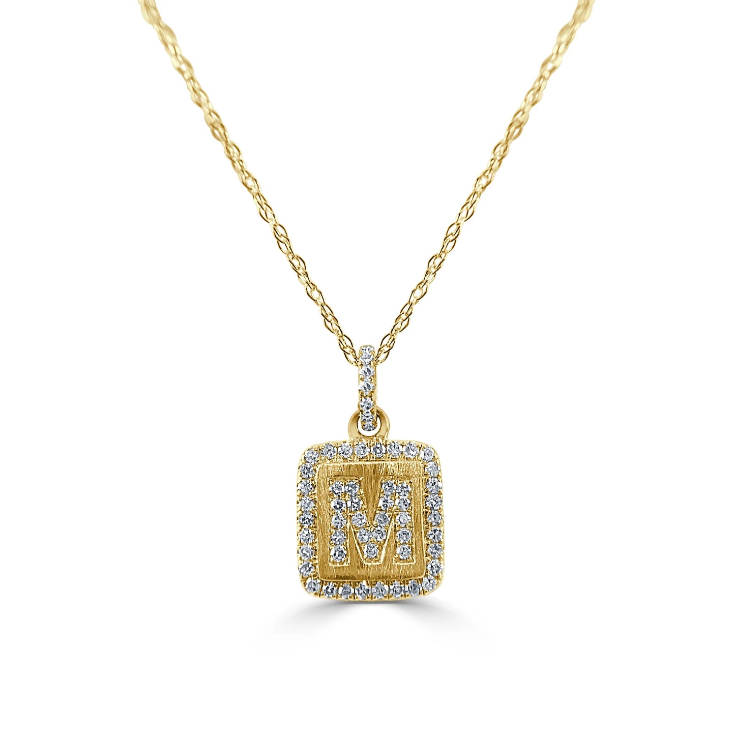 gold and diamond pendant with a letter M