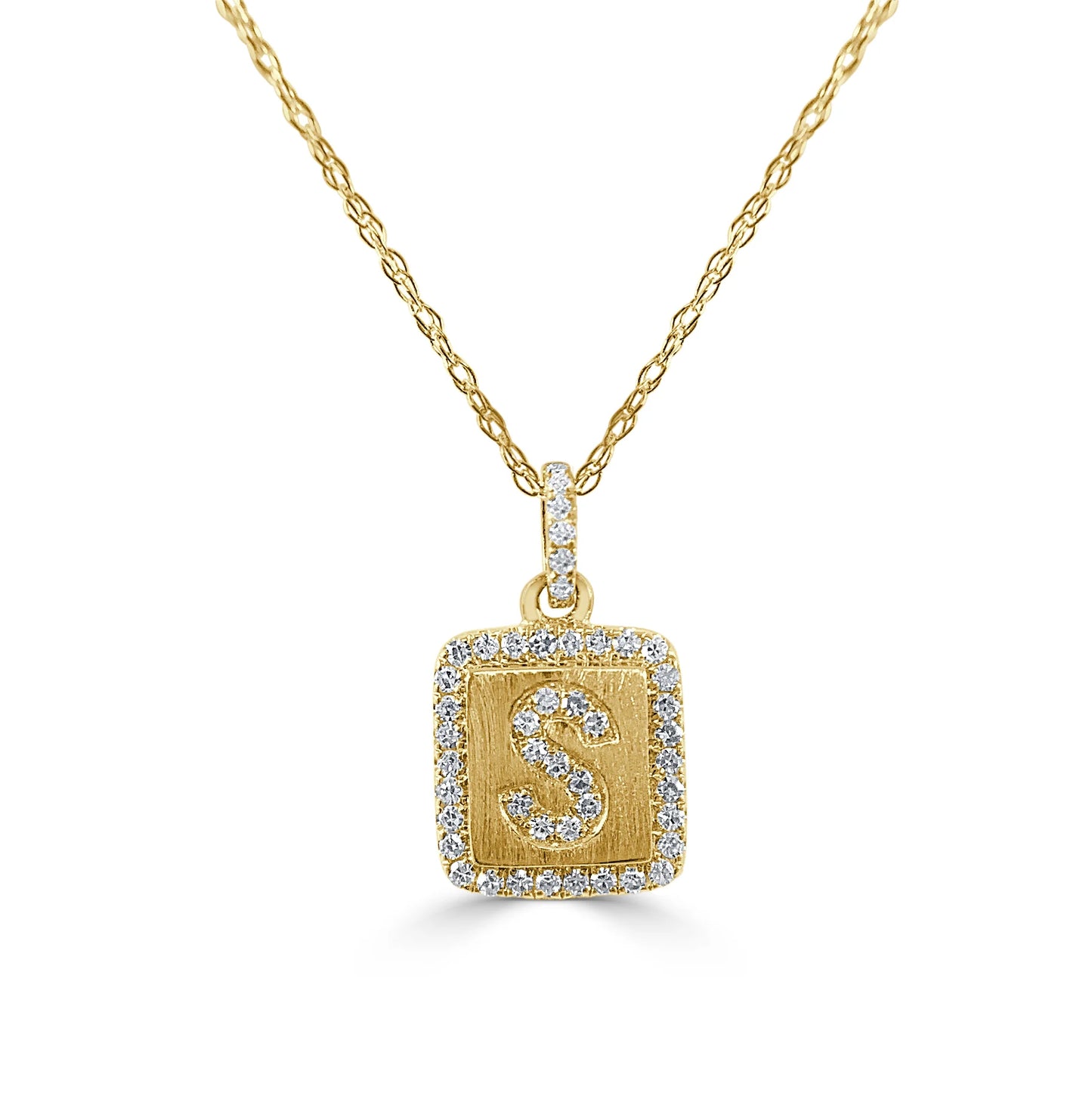 gold and diamond pendant with a letter S