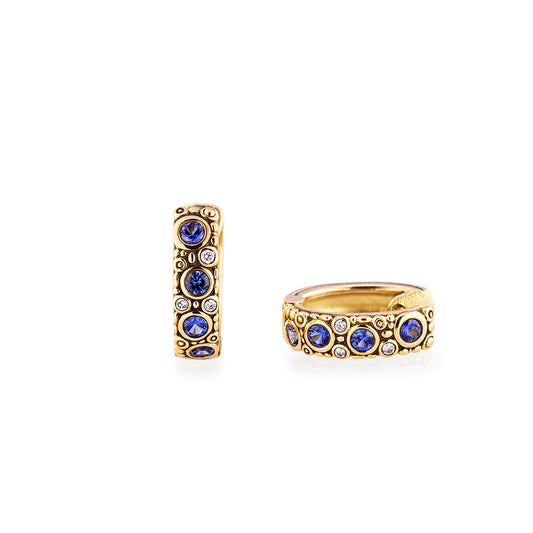 blue gemstones and diamonds in gold hoops