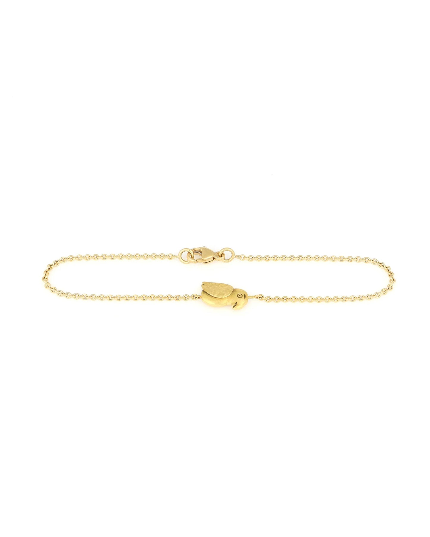 gold thin bracelet chain with a gold bird