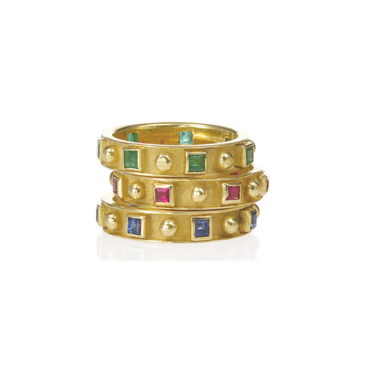 three rings stacked on top of each other with different gemstones