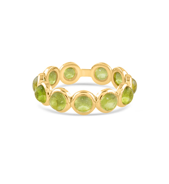 green colored gemstone ring with gold band