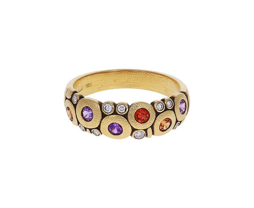 front view of gold ring with colorful gemstones