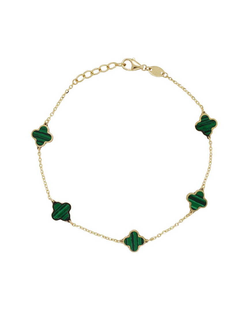 green colored clovers around a gold chain