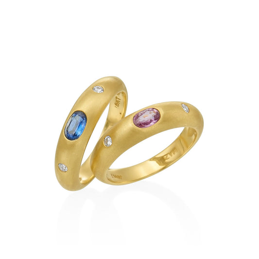 colorful gemstones in two rings