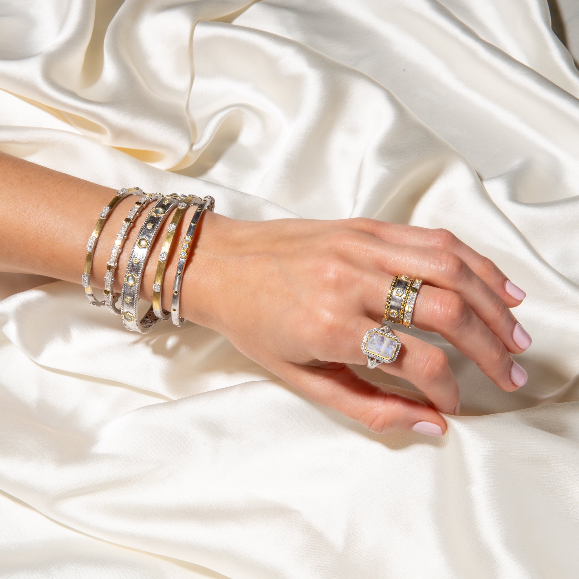 arm with bracelets and rings