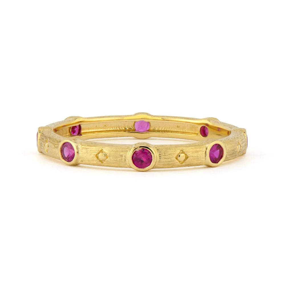 gold band with ruby gemstones