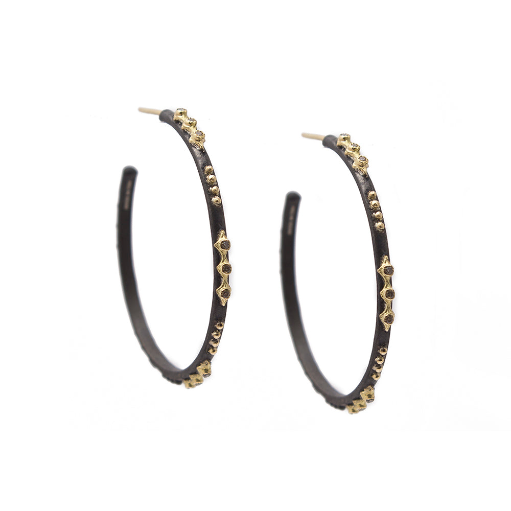 black and gold hoops with gemstones