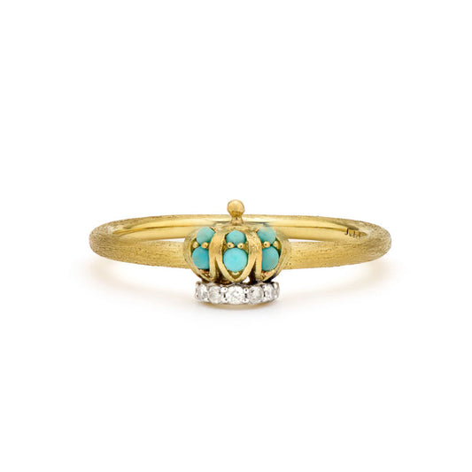 gold ring band and gold crown with blue gemstones and diamonds