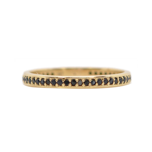 gold ring band with black gemstones